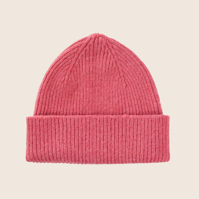 le bonnet en laine rose