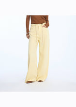 Load image into Gallery viewer, MUNTHE Obey Pants In Lemon - worn view