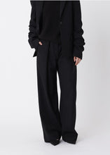Load image into Gallery viewer, Won Hundred Lulu Trousers In Black — worn view, face cropped