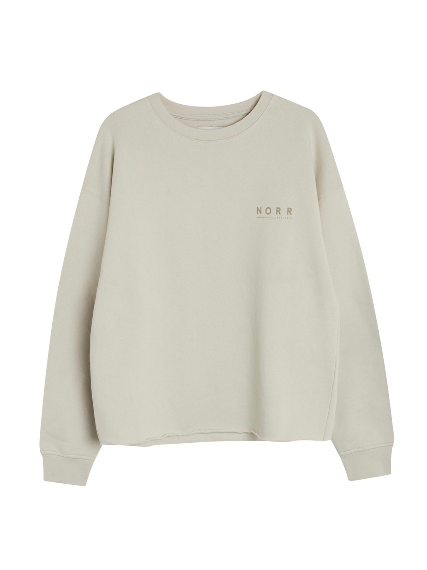 NORR Daisy sweat top is an oversized and cosy sweat with a raw hem and logo print detail. Made in organic cotton with a brushed finish inside. Organic cotton