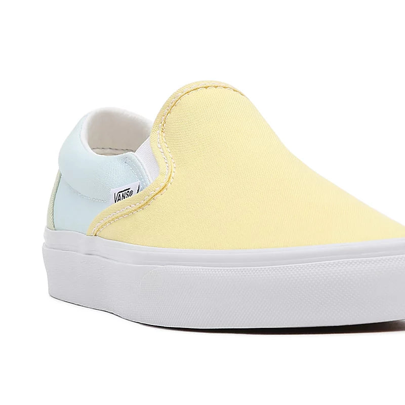 Pastel yellow top vans slip on